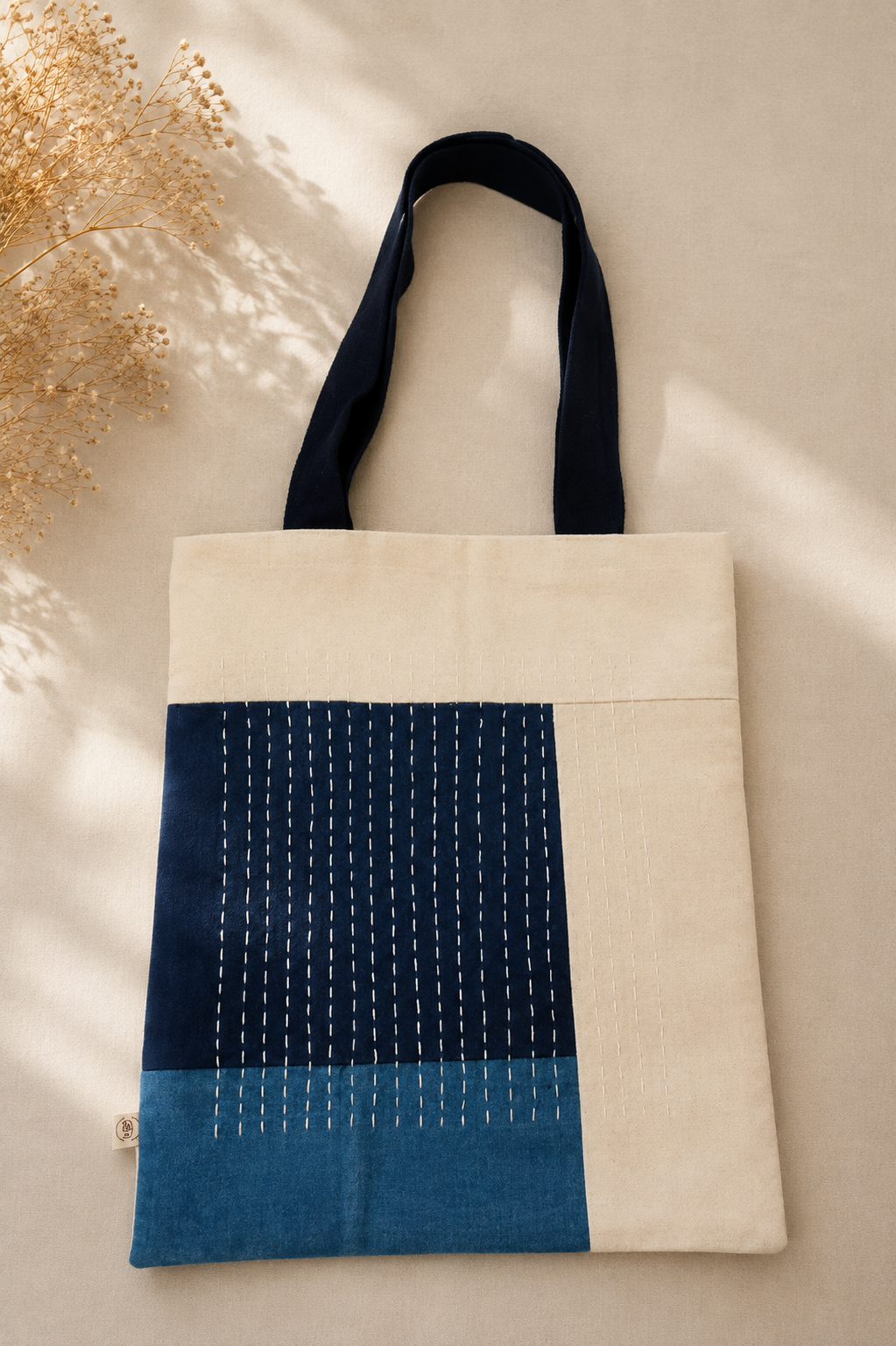 Upcycled denim patchwork handcrafted on canvas tote with contrast stitch work 